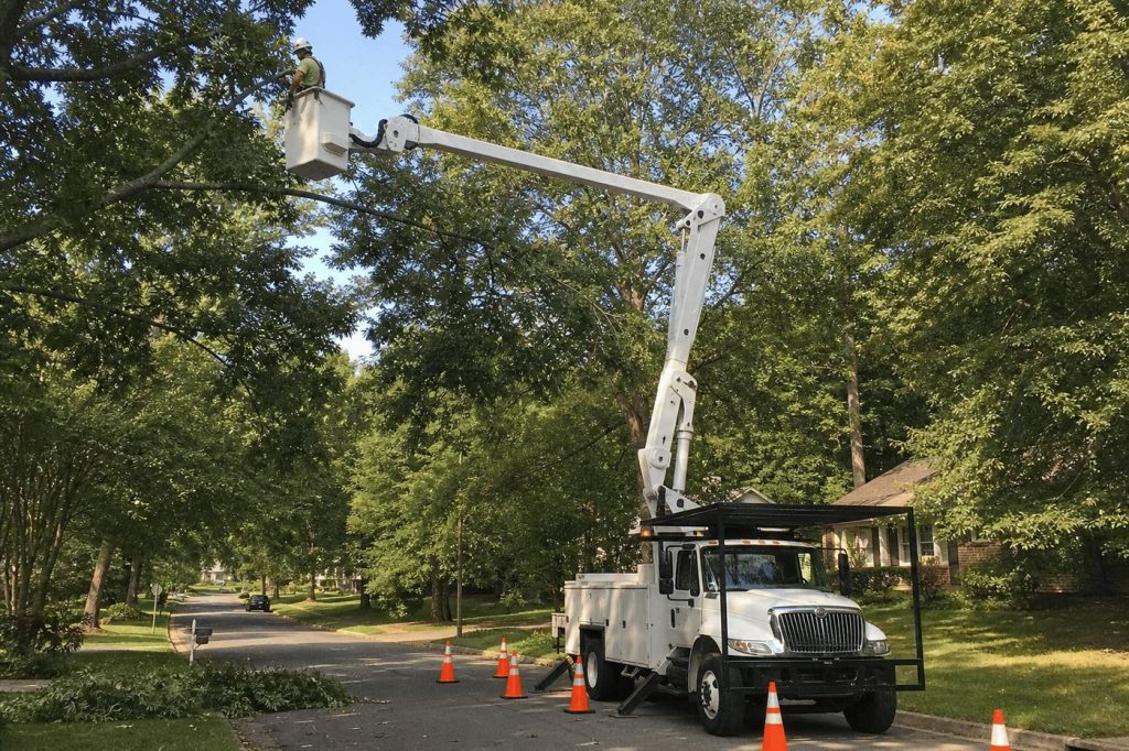 Bucket truck positioned for a removal over a street in Danville, Virginia